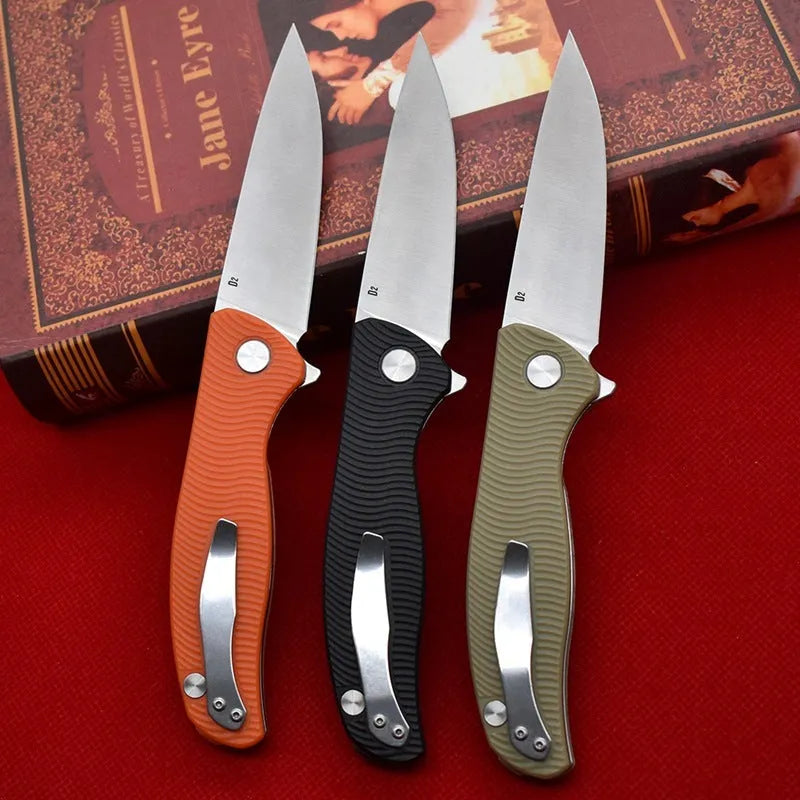 Outdoor folding knife with D2 steel blade, 9.6 cm blade length, 4.0 mm edge thickness, and nylon glass fibre handle in Black or Orange