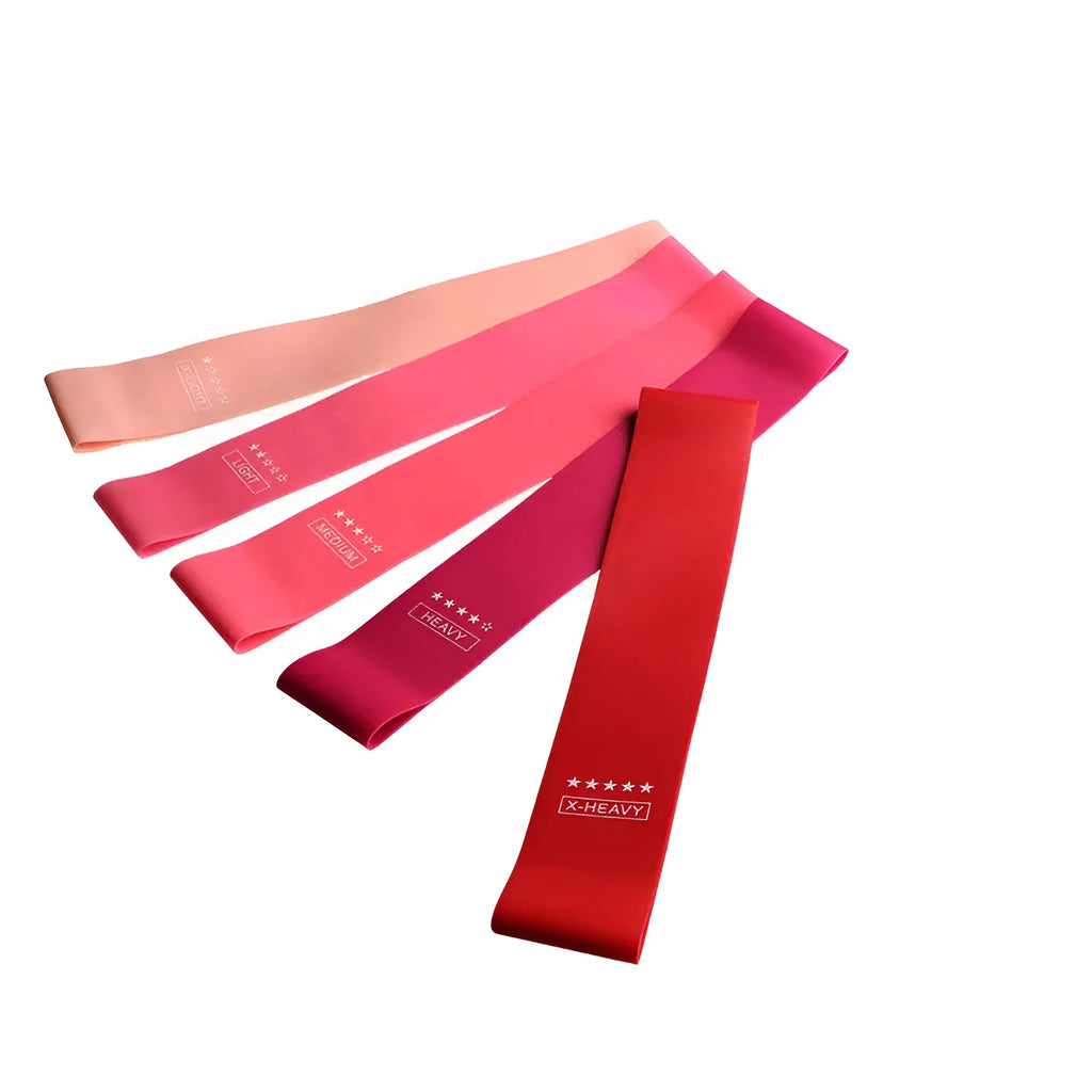 Five pink gradient latex yoga tension bands laid flat showing increasing resistance levels from light pink to rose red