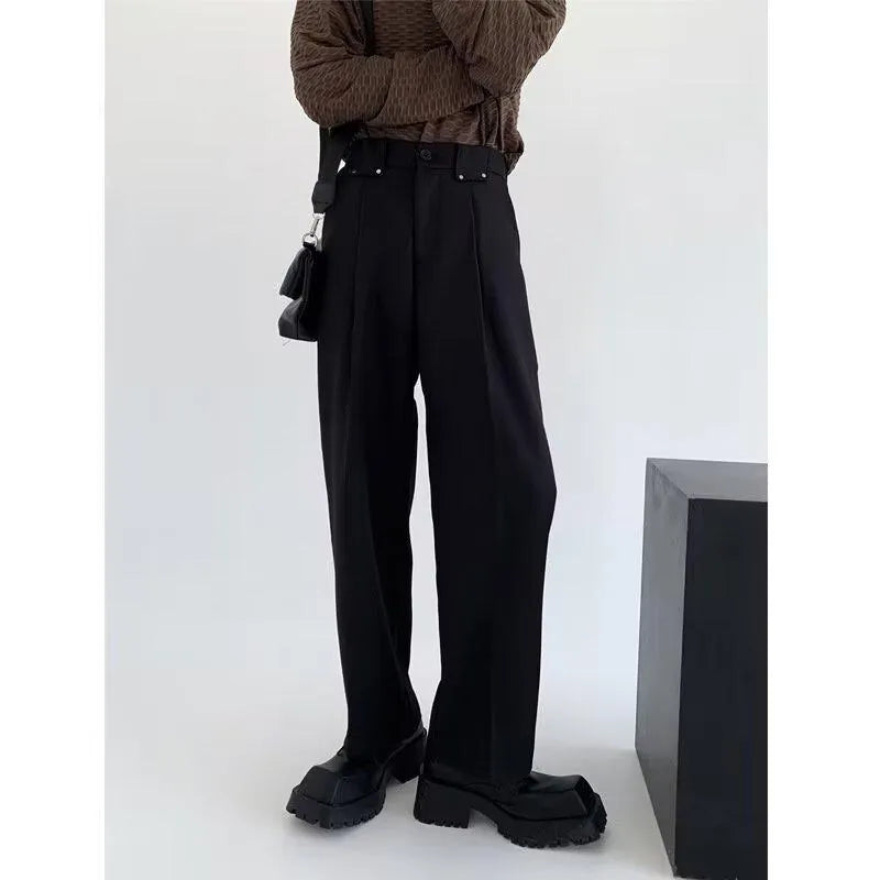 Women's black high-waisted cropped suit pants with draping effect, sizes M-3XL, on display
