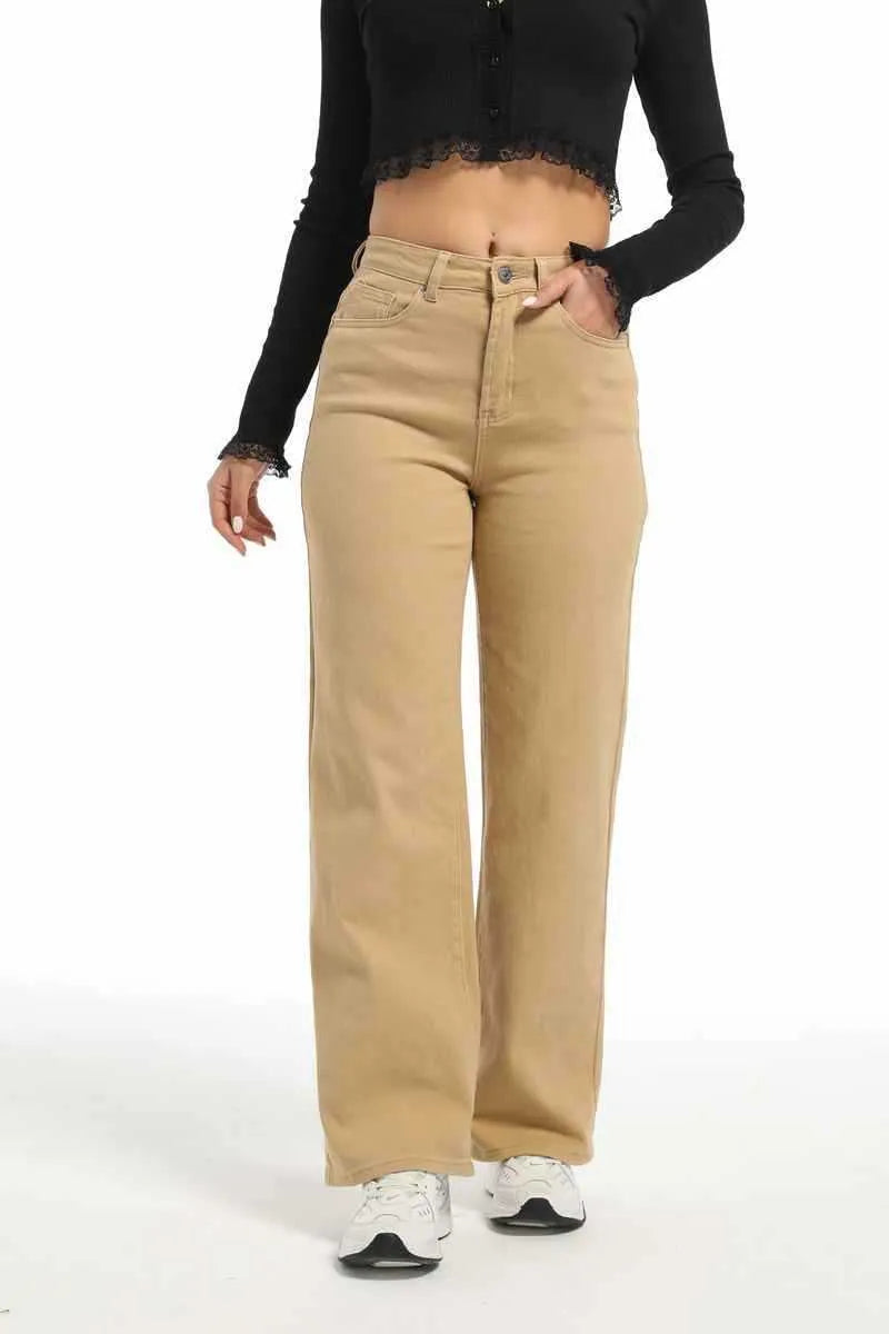 Women's high-waisted straight leg jeans in apricot colour, showing wide leg and elastic cotton fabric.