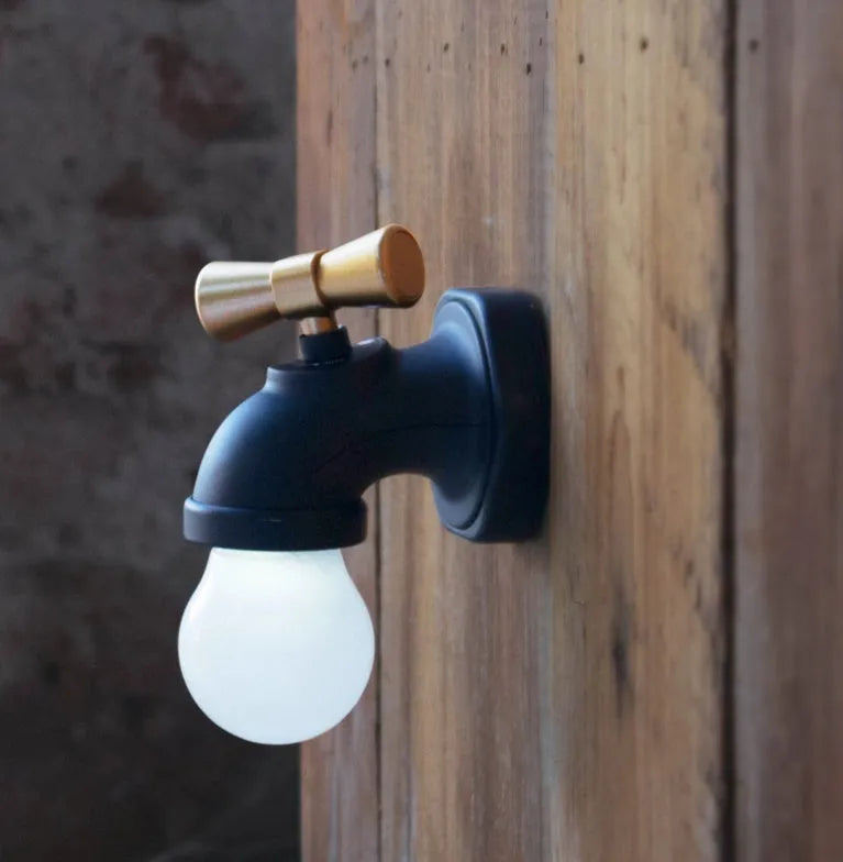 Black and white faucet-shaped USB rechargeable night lamp with sound activation feature