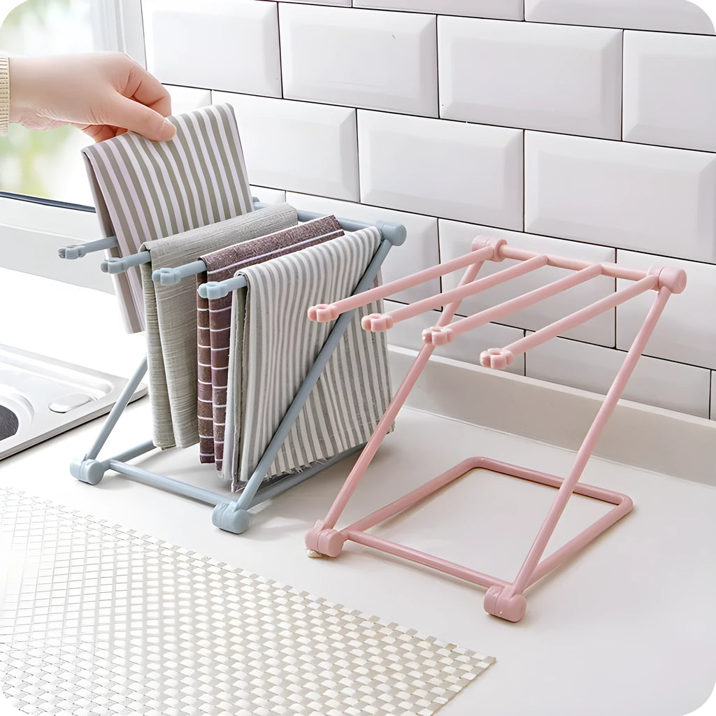 Foldable light grey plastic dishcloth shelf with vertical design mounted on a wall