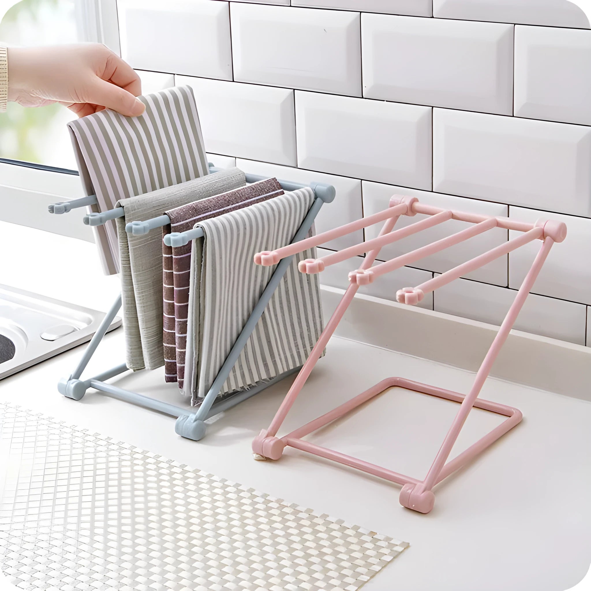 Foldable light grey plastic dishcloth shelf with vertical design mounted on a wall