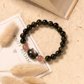 Black 8mm natural obsidian bead bracelet with silver kitty charm on elastic band