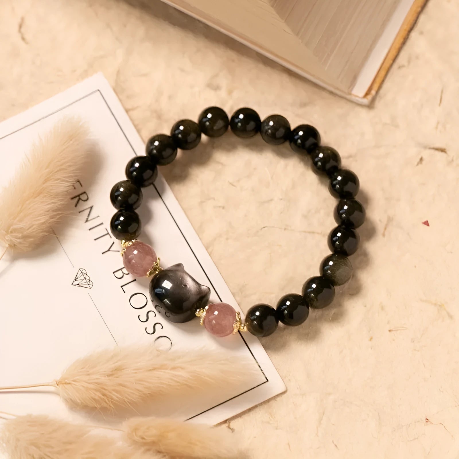 Black 8mm natural obsidian bead bracelet with silver kitty charm on elastic band