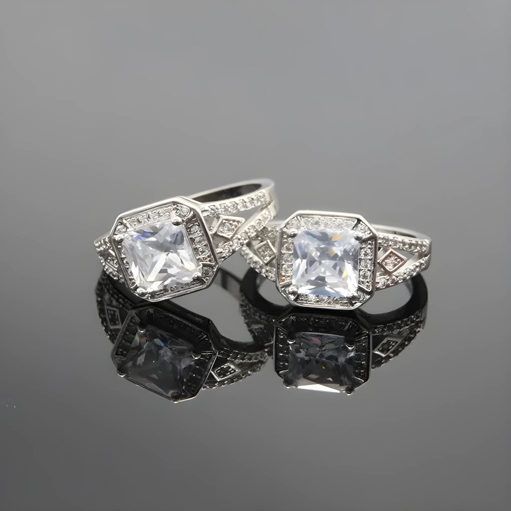Platinum-colour hollow geometric ring with an inlaid cubic zirconia stone, shown from the side.
