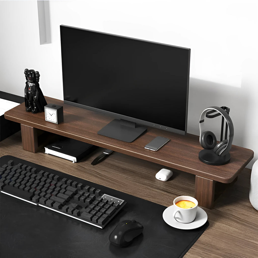 solid walnut wood computer monitor heightening frame on a desk with extra storage underneath