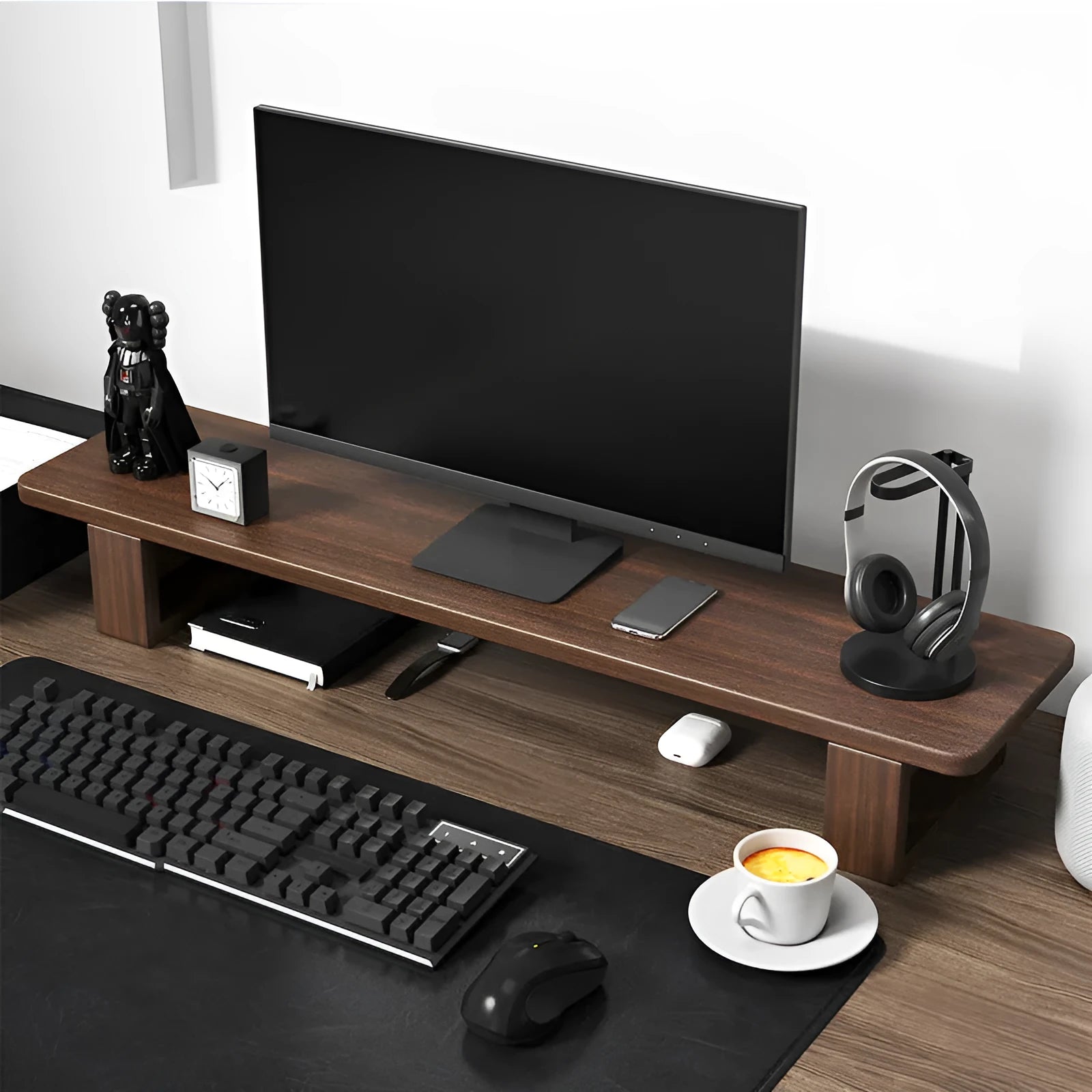solid walnut wood computer monitor heightening frame on a desk with extra storage underneath