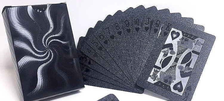 Black Diamond waterproof plastic poker cards with gold foil finish showing laser-etched diamond pattern on black background