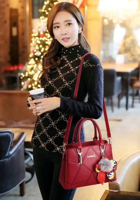 Women's cross section square PU messenger bag with embroidery in royal blue colour showing soft handle and single shoulder strap