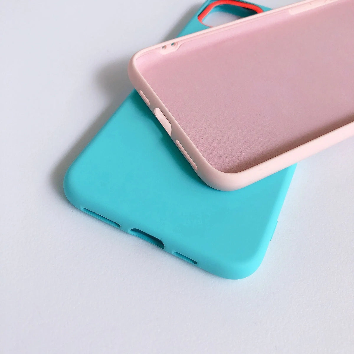 Silicone mobile phone case with macaron cartoon pattern in pink, fitted on an iPhone