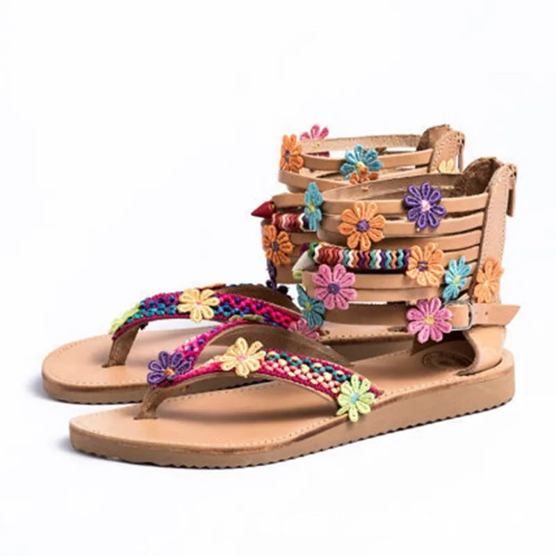 Women's ethnic beaded petal sandals in synthetic PU leather with floral design and round toe.