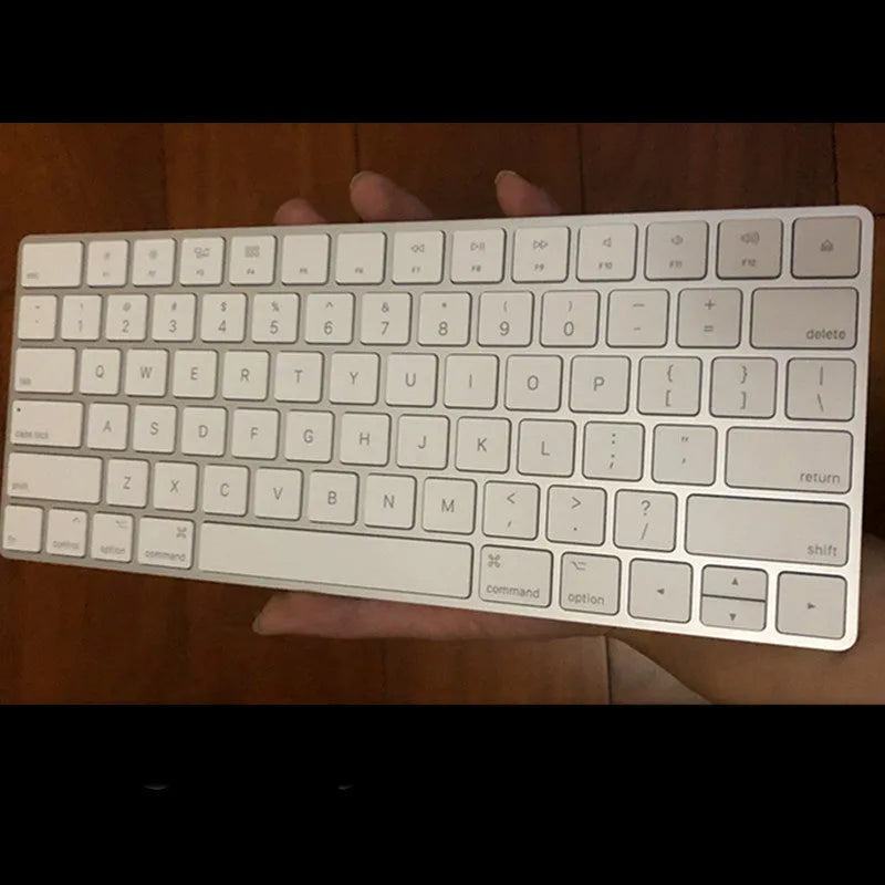 Apple white metal Bluetooth wireless keyboard with ultra-thin design and multimedia function keys
