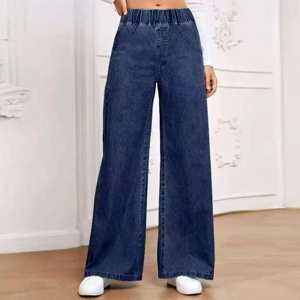 Light blue washed wide-leg denim trousers with straight silhouette and zip-fly placket