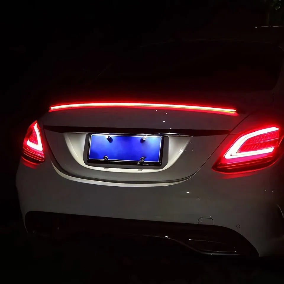 Automobile streamer tail LED turn signal strip showing red and colourful lighting patterns