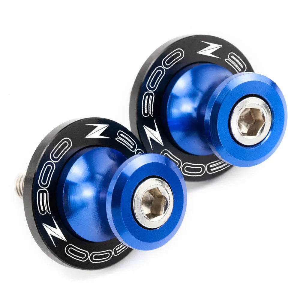 Pair of CNC aluminium swingarm spools for Kawasaki Z650 Z900 in anodised colour, with Delrin sliders and stainless steel bolts
