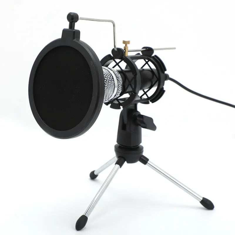 Black or silver condenser microphone on aluminium stand with 3.5mm and USB cables for mobile phone and computer broadcasting