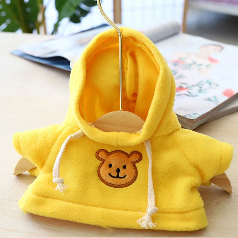 A dog wearing a soft cloth zip-up hoodie sweater in a choice of colours including a grey bear print.