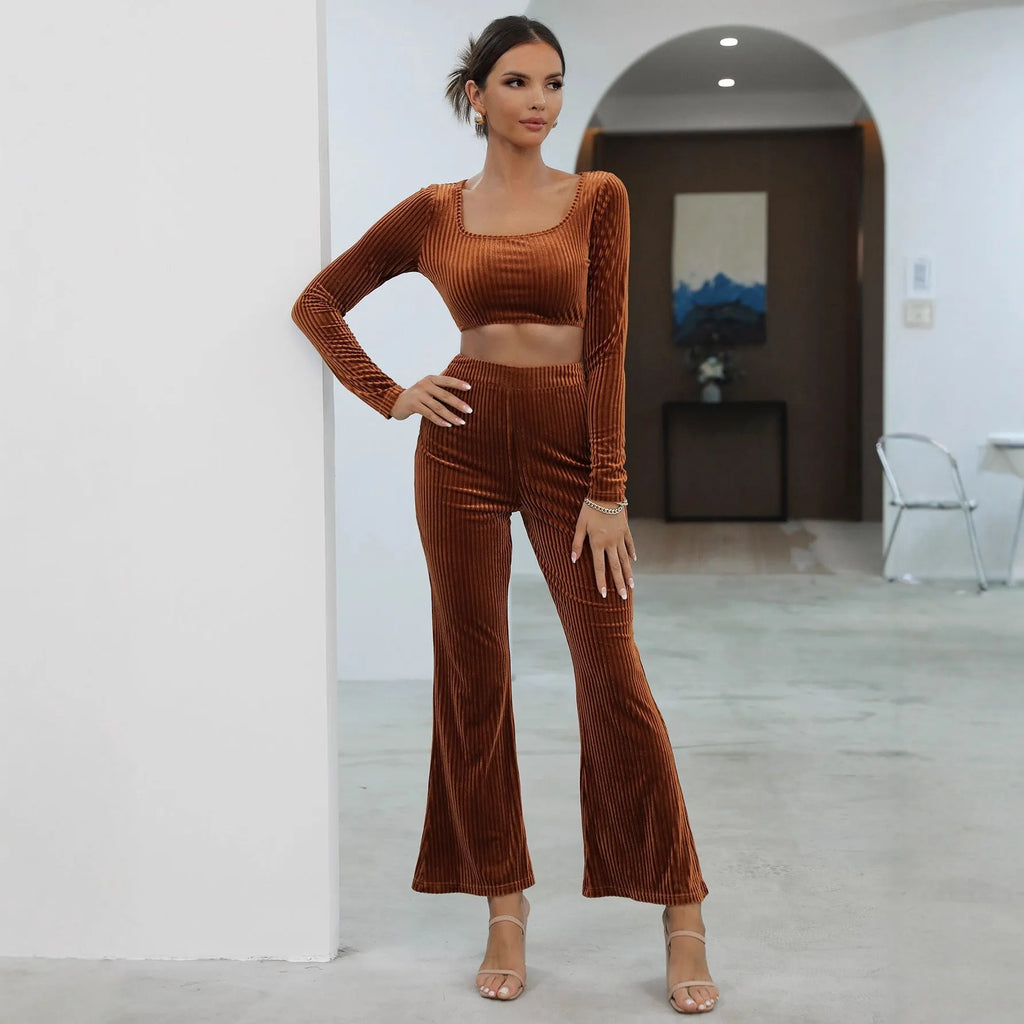 Caramel coloured long sleeve sweater and matching trousers set on a hanger.