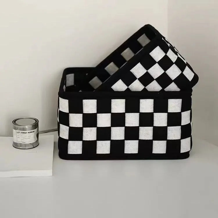Grey checkerboard patterned folding felt storage basket with dimensions 37cm by 29cm.
