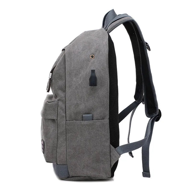 Canvas USB rechargeable backpack in khaki colour showing laptop pocket and shoulder straps