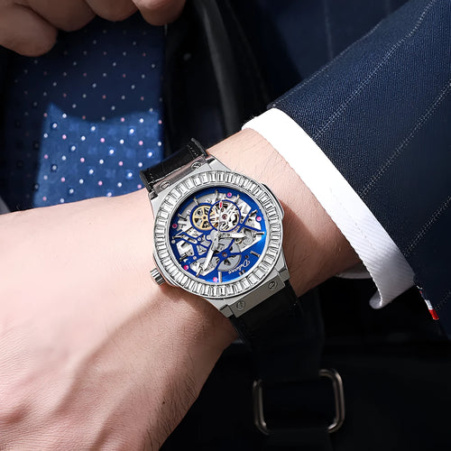 Men's automatic skeleton watch with diamond accents on dial, stainless steel case, leather strap.