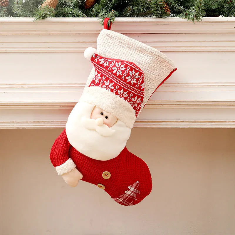 Large red and white knitted Christmas stocking with Santa Claus design hanging on a fireplace