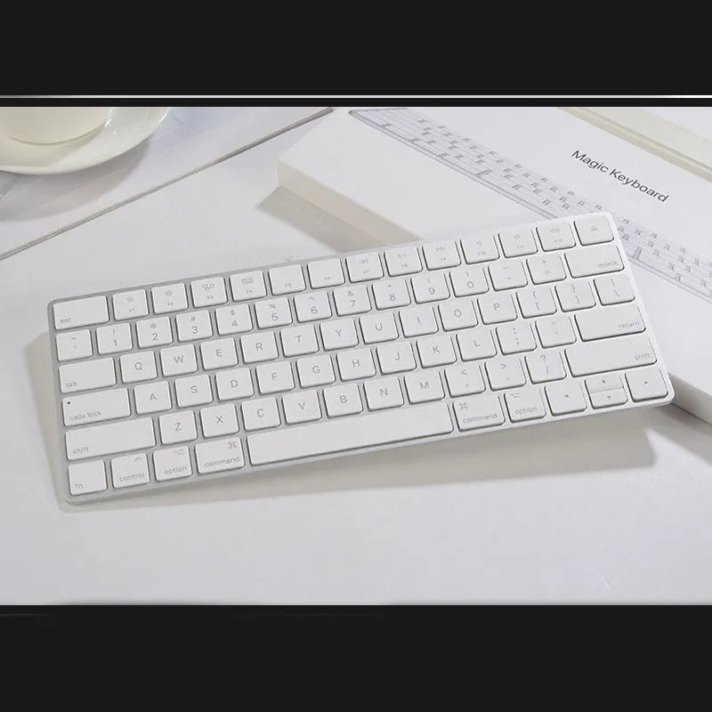 Apple white metal Bluetooth wireless keyboard with ultra-thin design and multimedia function keys