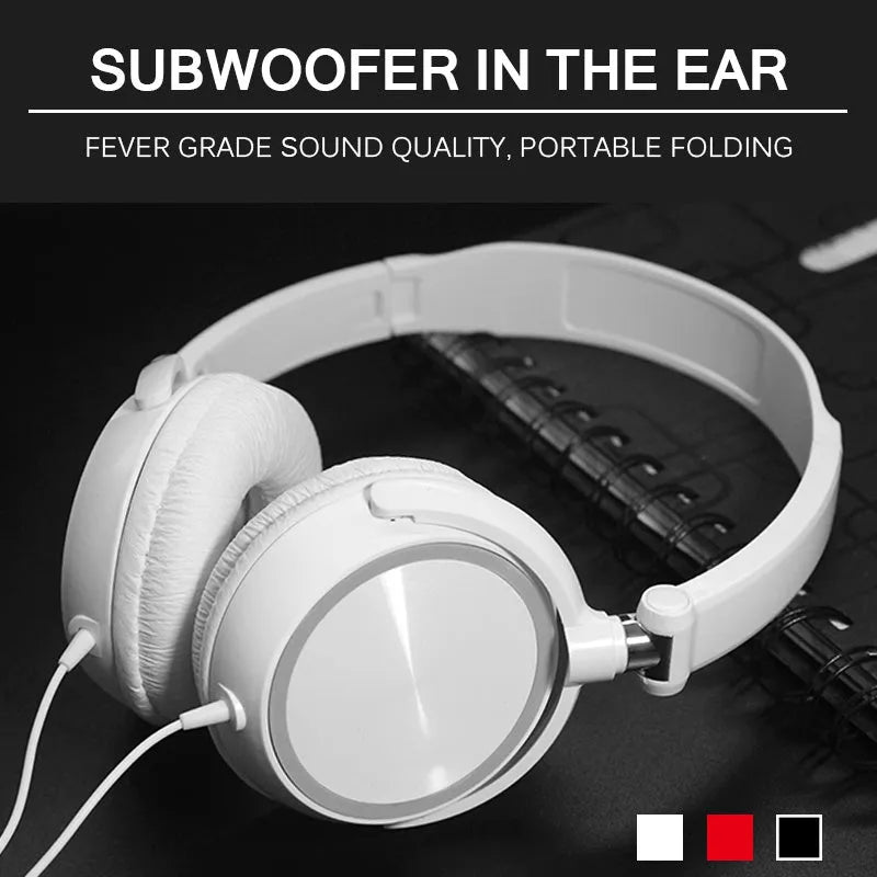 Red folding over-ear wired headphones with adjustable headband and 3.5mm plug on a table