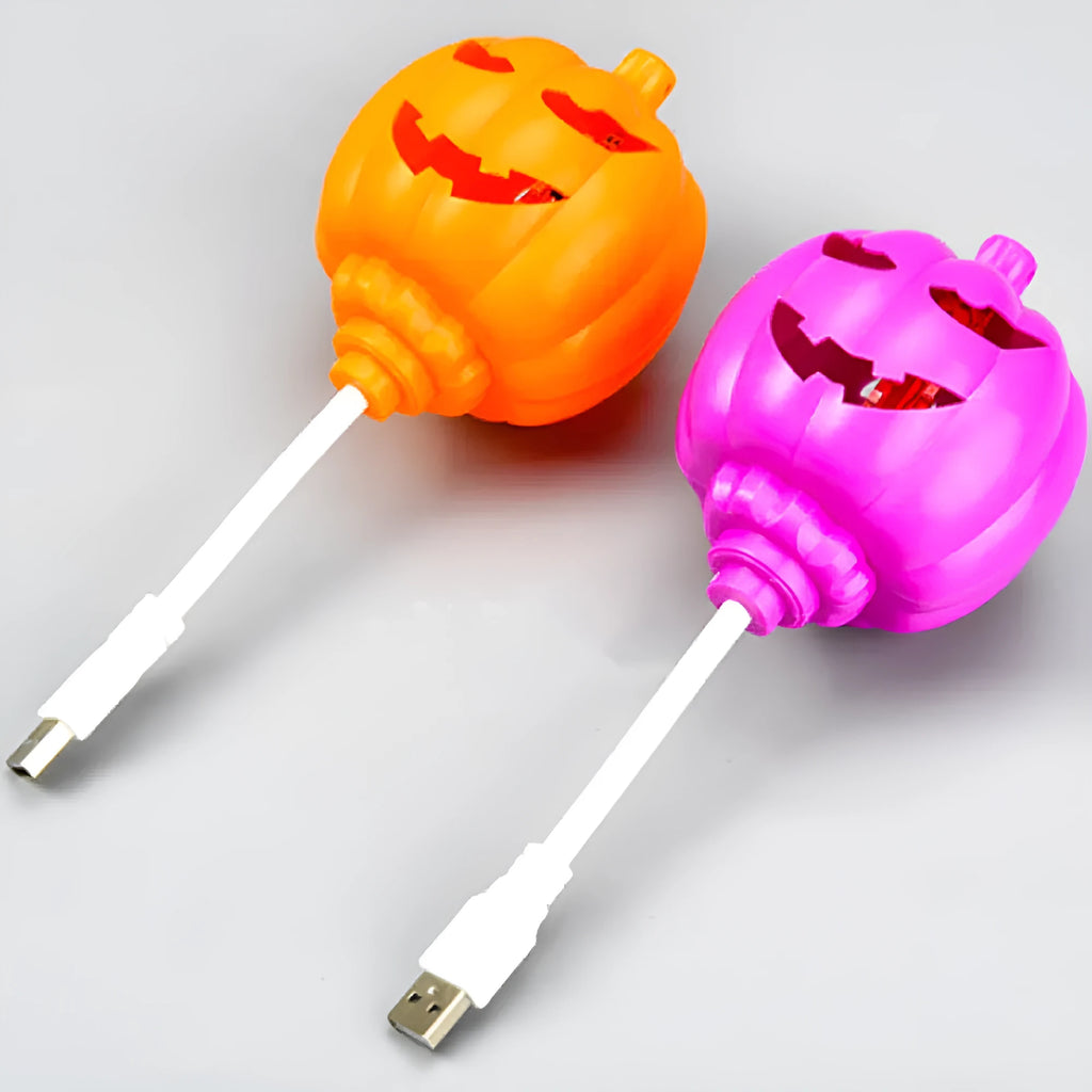 Plastic pumpkin lamp with USB charging cable showing yellow and purple light options