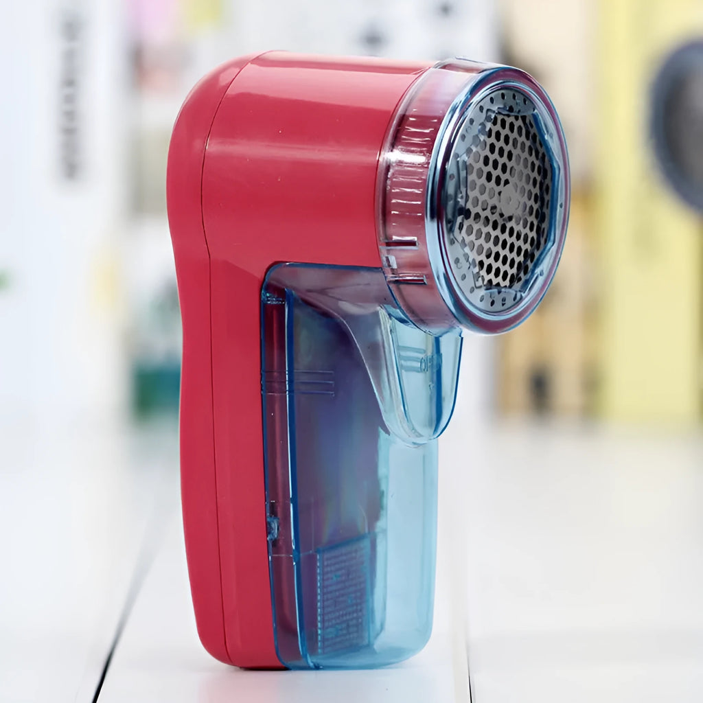 Portable electric lint remover device for removing pills from sweaters and fabrics