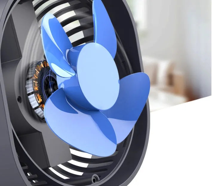 USB desk fan with 360-degree rotation in blue, on a desk next to a laptop.