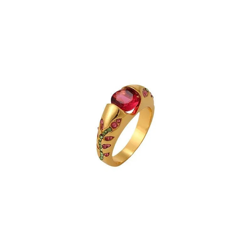 Leaf style zinc alloy ring with round zirconium inlay in gold colour on white background