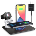 Black desktop wireless charging station with phone on pad and ports for watch and headphones.