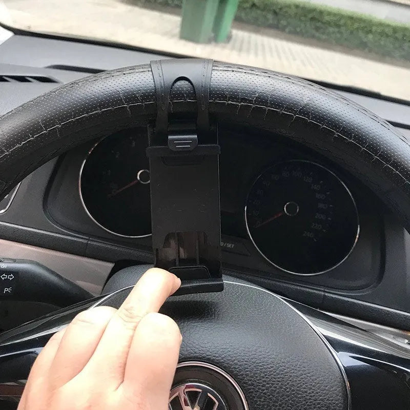 Black universal steering wheel phone mount clip holding a smartphone for hands-free use while driving.