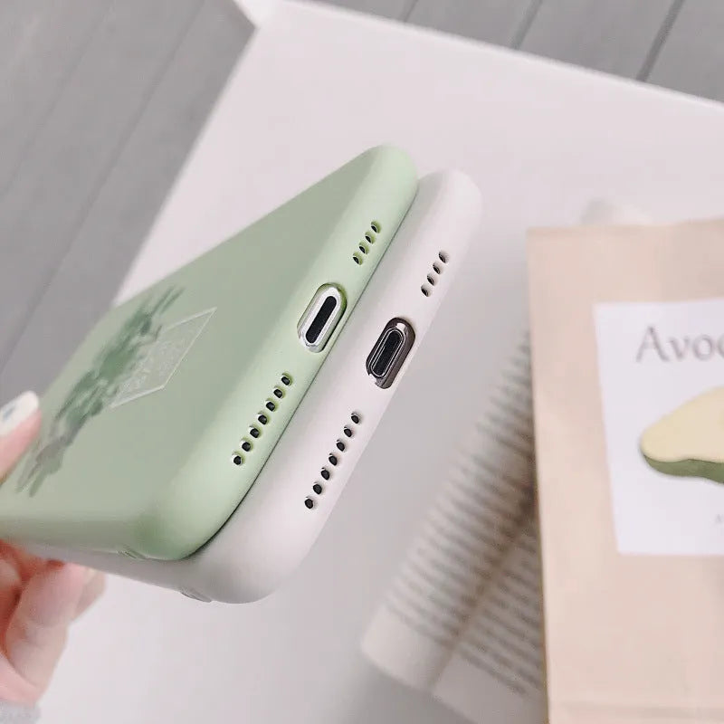 White silicone iPhone case with detailed painted plant design on the back