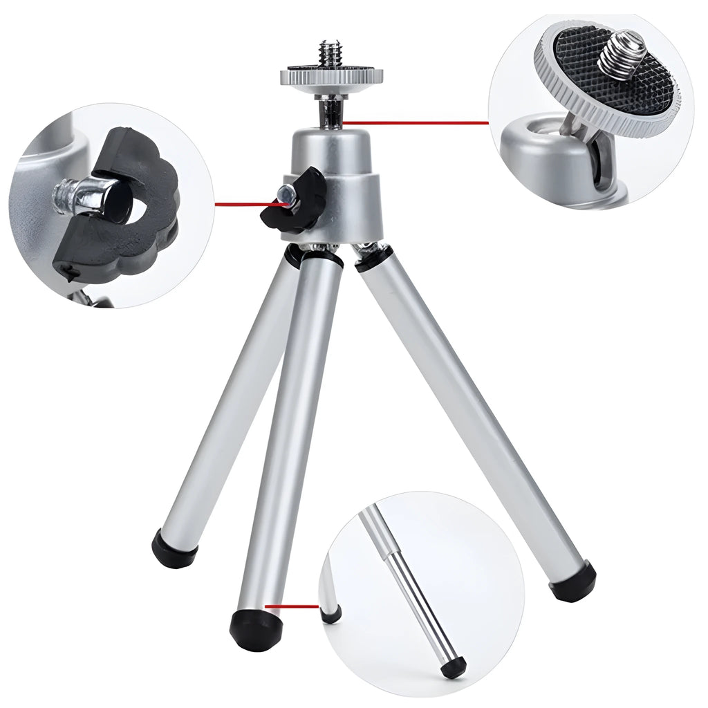 Mini aluminium tripod with extended legs and a black U-shaped phone clip attached