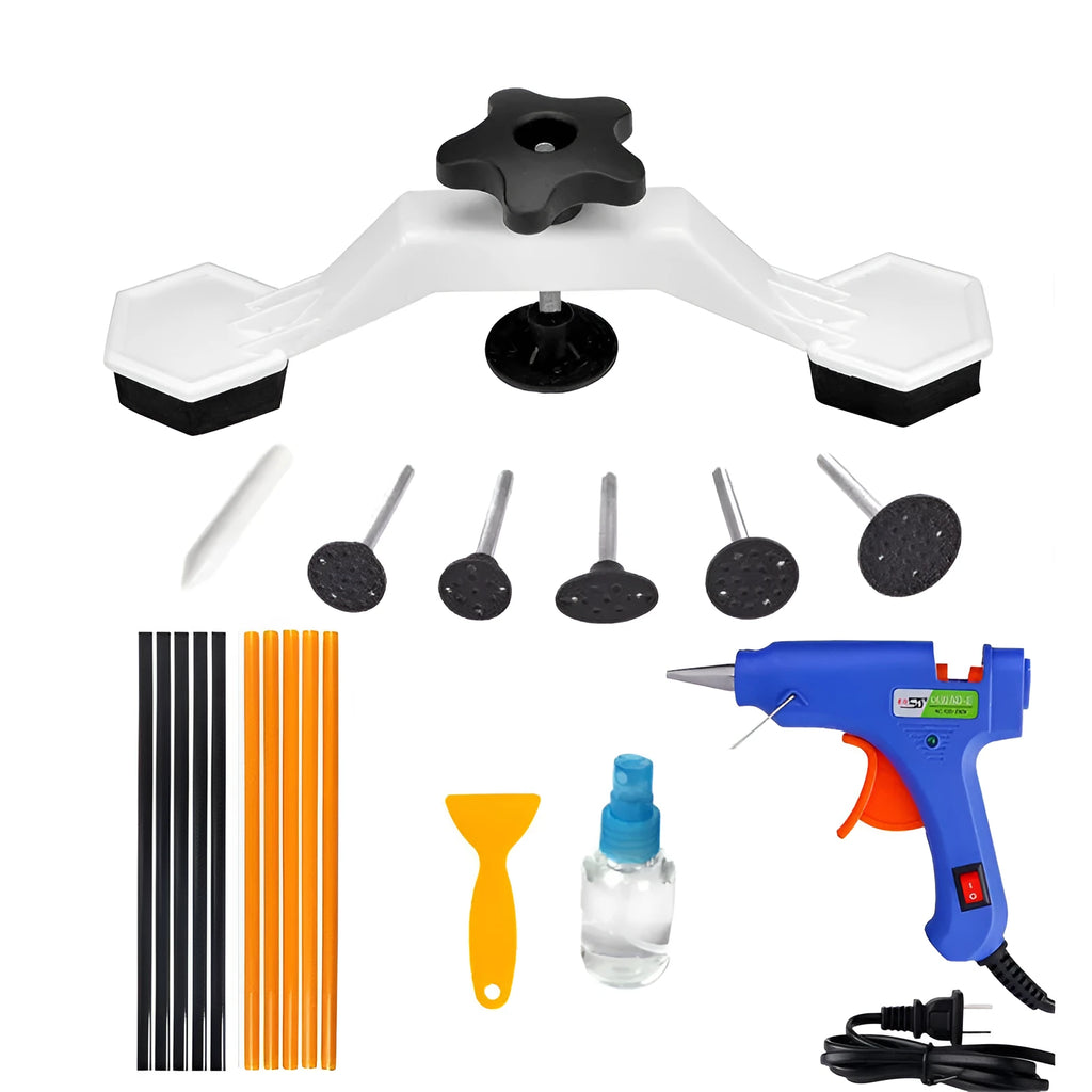 White automotive dent repair kit with five approach bridges and 20W glue gun on workshop bench