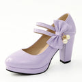 Red platform shoes with chunky heels, round toes, and buckle fastening on waterproof rubber soles