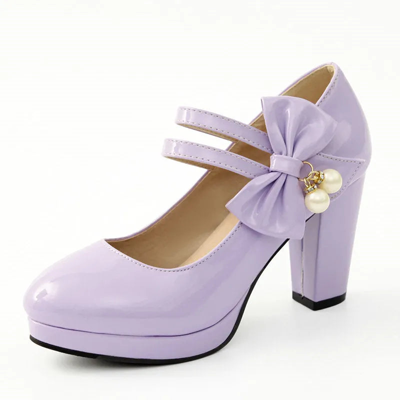 Red platform shoes with chunky heels, round toes, and buckle fastening on waterproof rubber soles
