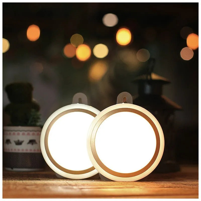 Compact circular white motion sensor LED light with 80mm diameter for automatic wardrobe or corridor lighting.