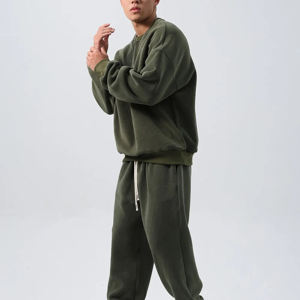 Men's black polar fleece winter sports suit with loose fit long sleeve coat and matching trousers
