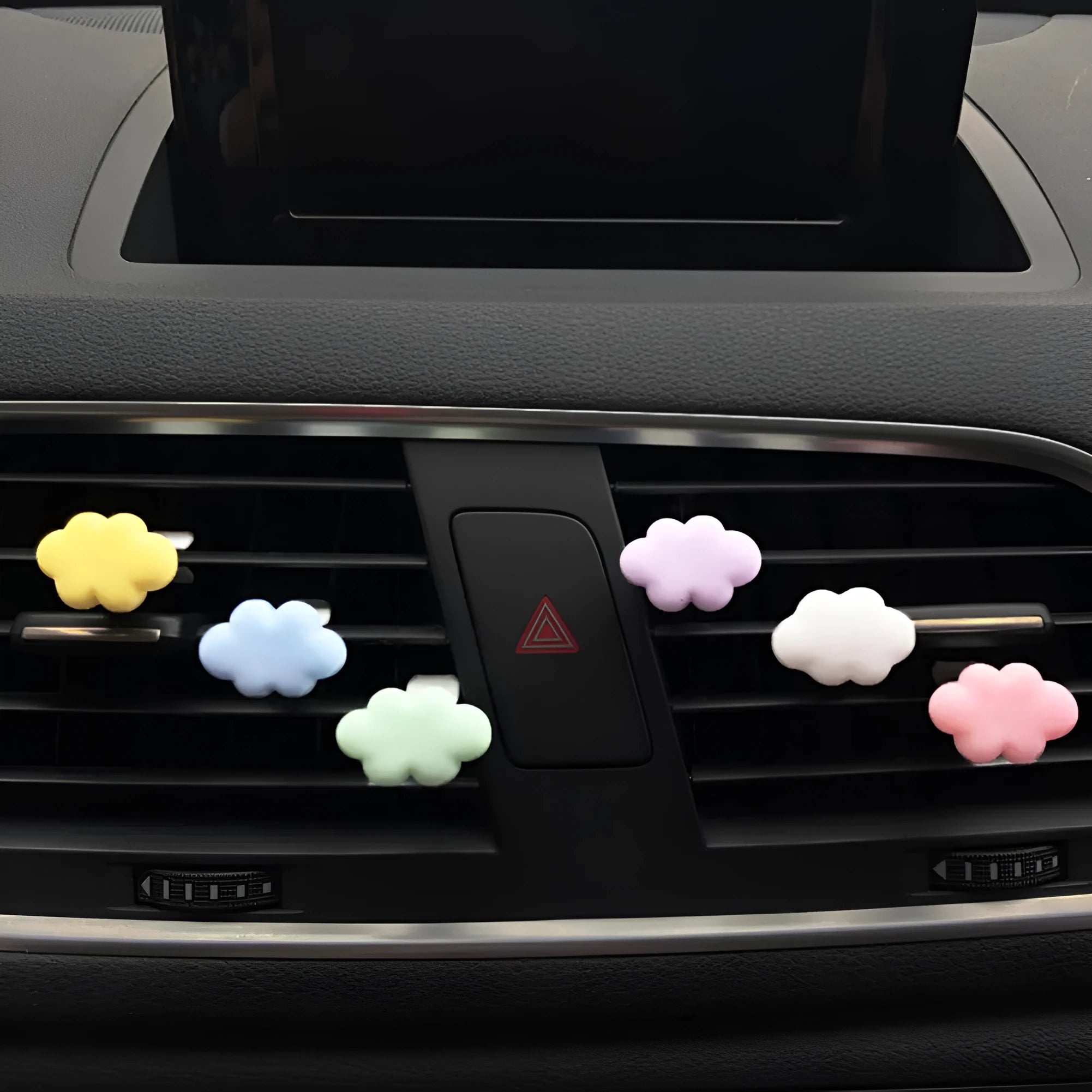 Colourful resin cartoon cloud car air freshener clip on a car vent.
