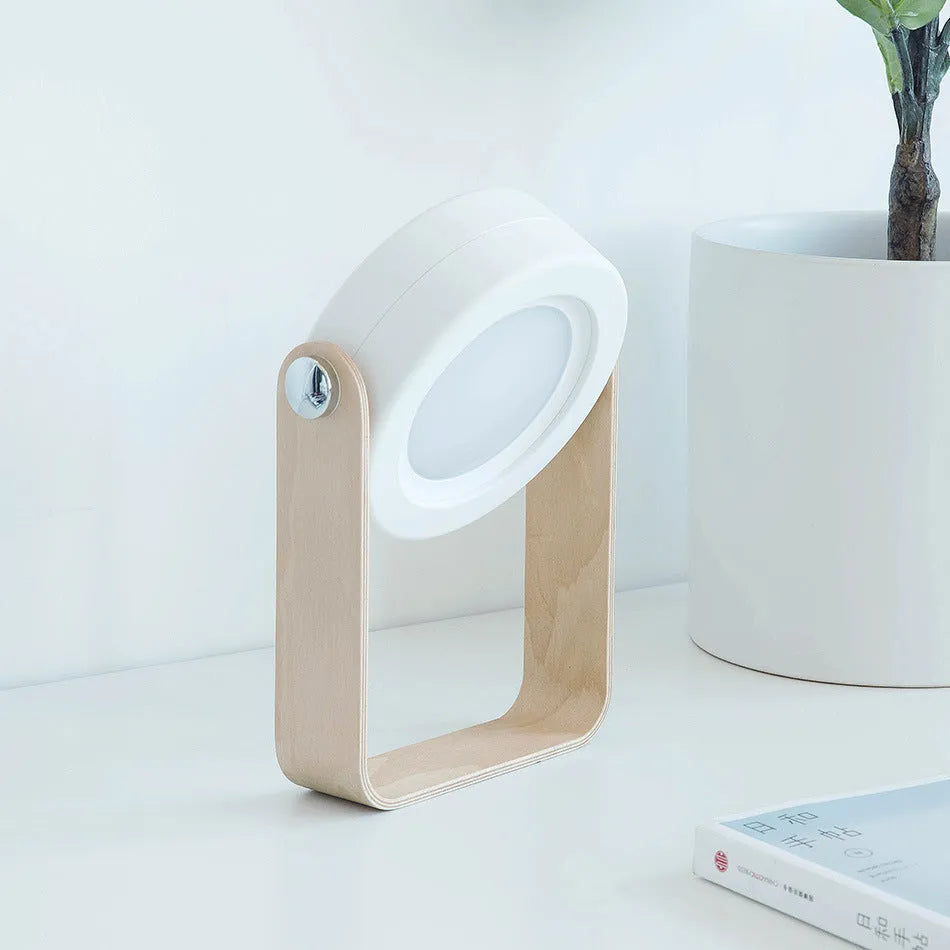 White foldable LED night light in both table lamp and tall lantern configurations, with USB cable.
