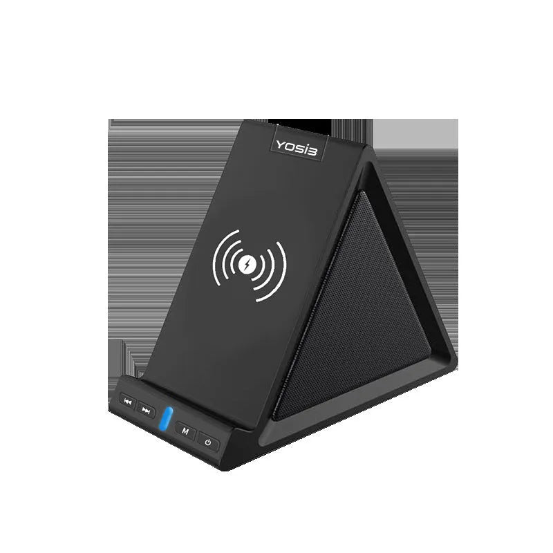 Black multifunctional Bluetooth speaker with integrated mobile phone stand and wireless charging pad on a desk