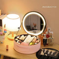 Round cherry blossom pink LED makeup bag open showing internal mirror, lights, and cosmetic partitions.