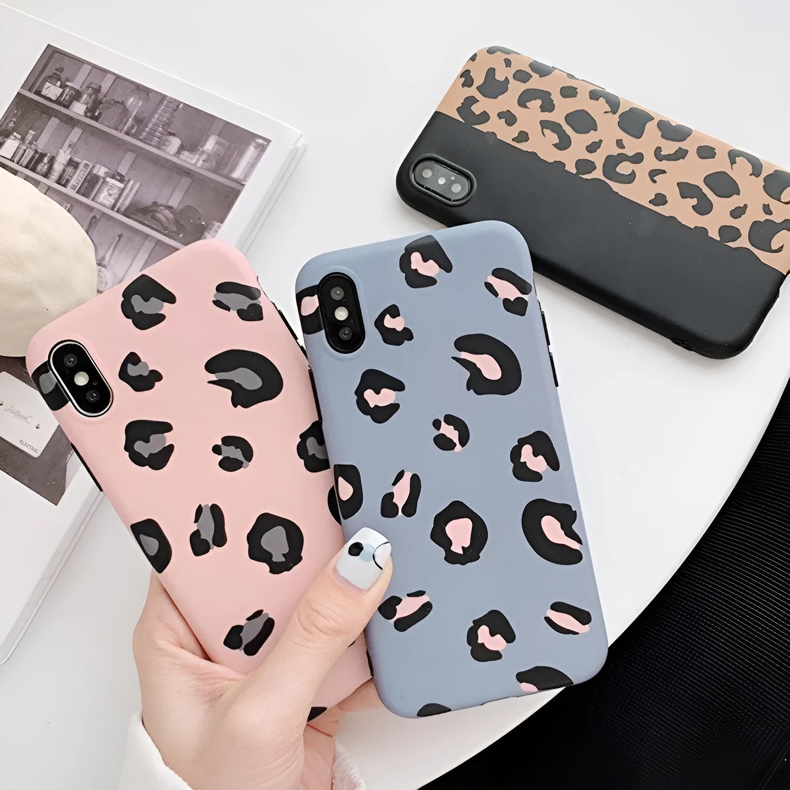 Leopard print pattern phone case for iPhone, shown in black, blue, and pink colour options.