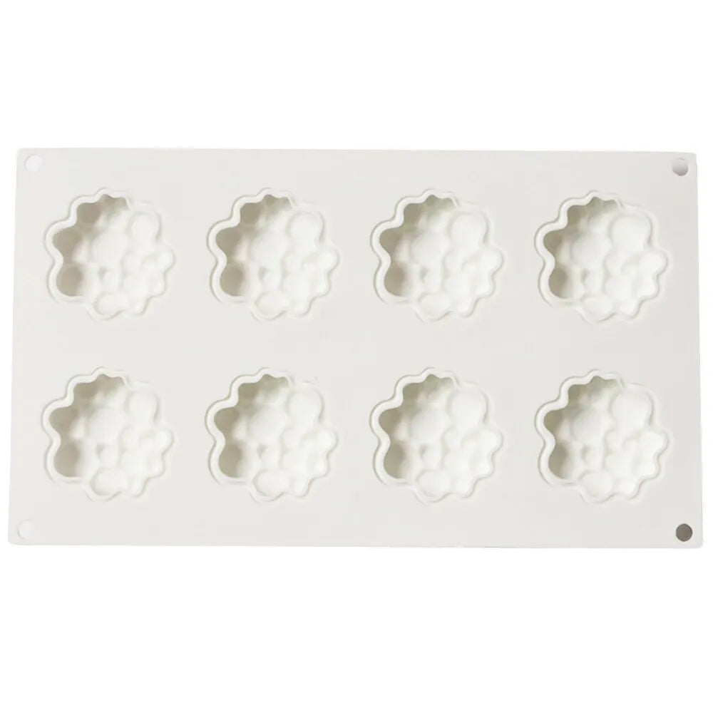 Round silicone cake mould with bubble tower pattern showing 8 raised decorative bubbles