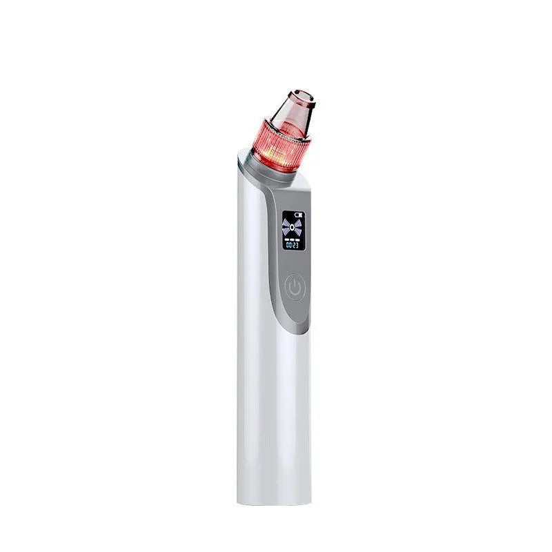 White handheld ultrasonic facial cleansing instrument with interchangeable suction heads on a clean surface.