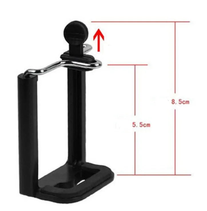 Mini aluminium tripod with extended legs and a black U-shaped phone clip attached